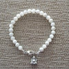 MOTHER OF PEARL (6MM) BRACELET  WITH MINI BUDDHA CHARM