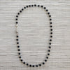 MATTE BLACK ONYX (6MM) NECKLACE WITH SKULL BEAD-24"
